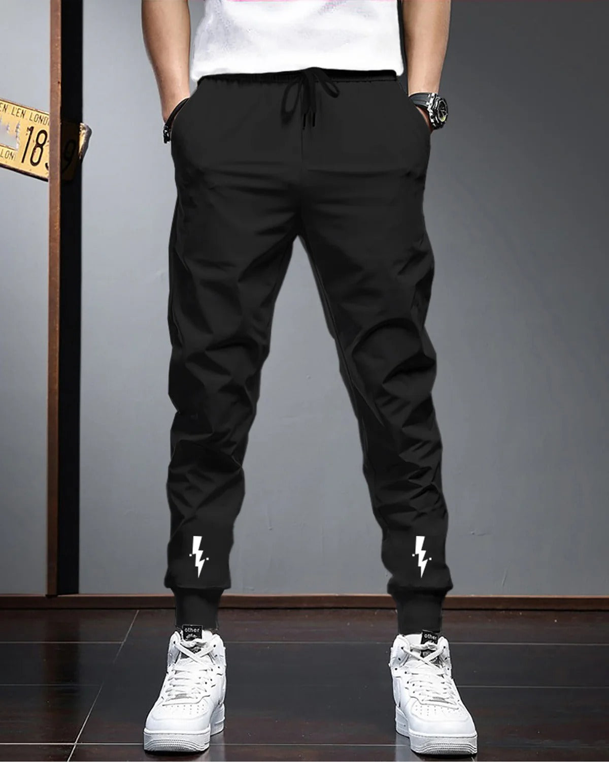 Men Solid Black Elastic Cuffed Ankles Drawstring Track Pant